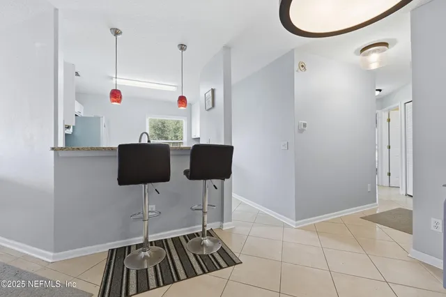 a view of kitchen with furniture and cabinets