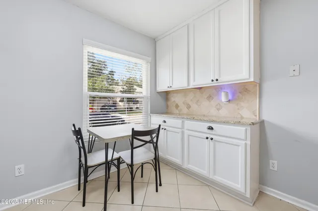 a kitchen with a sink cabinets and window