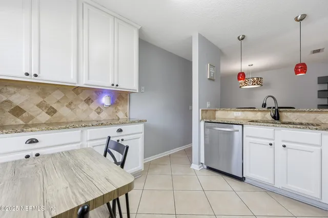 a room with a lamp and a table