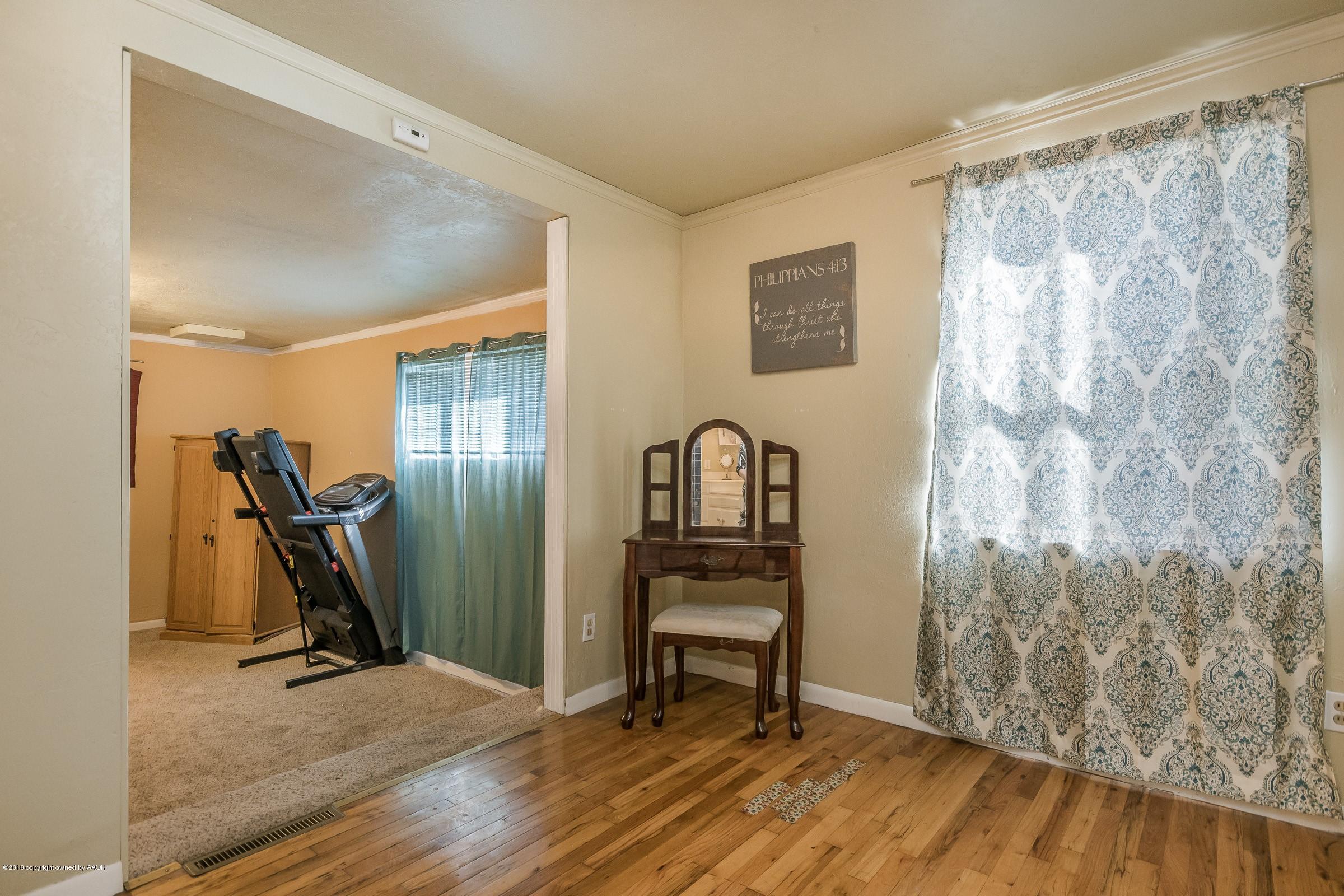 4635 South Hughes Street Amarillo, TX 79110 - Photo 14 of 20 a view of a room with gym equipment