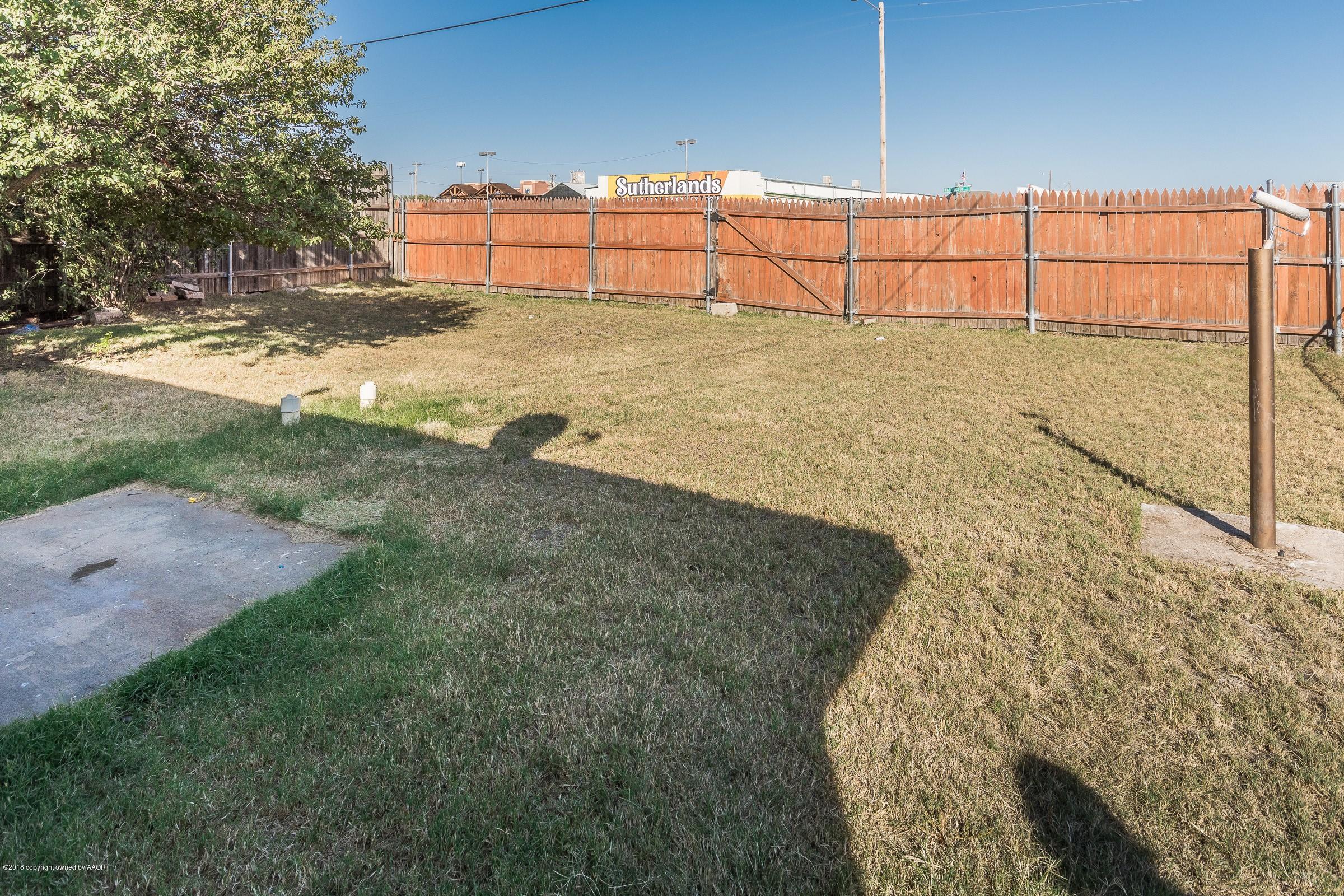 4635 South Hughes Street Amarillo, TX 79110 - Photo 18 of 20 a view of a yard