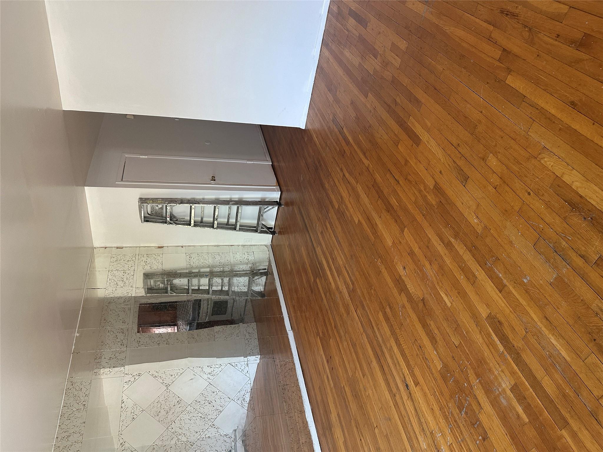 433 Howe Avenue, Unit A Bronx, NY 10473 - Photo 3 of 12 a view of a livingroom with wooden floor