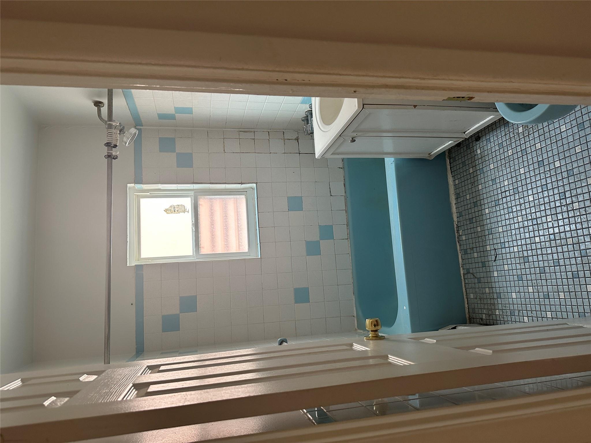 433 Howe Avenue, Unit A Bronx, NY 10473 - Photo 5 of 12 a bathroom with a bathtub a sink a toilet and a shower