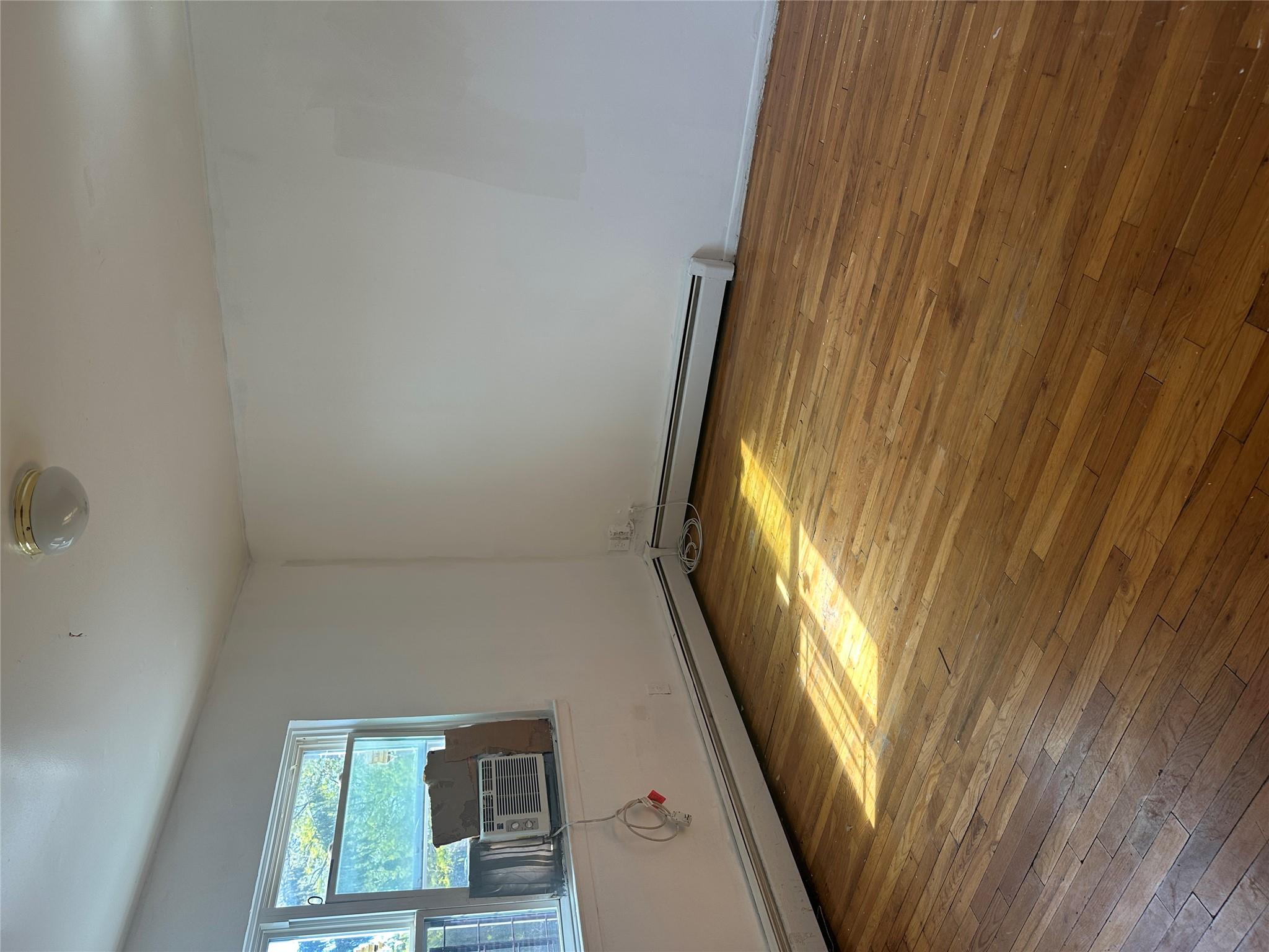 433 Howe Avenue, Unit A Bronx, NY 10473 - Photo 9 of 12 a view of empty room with window