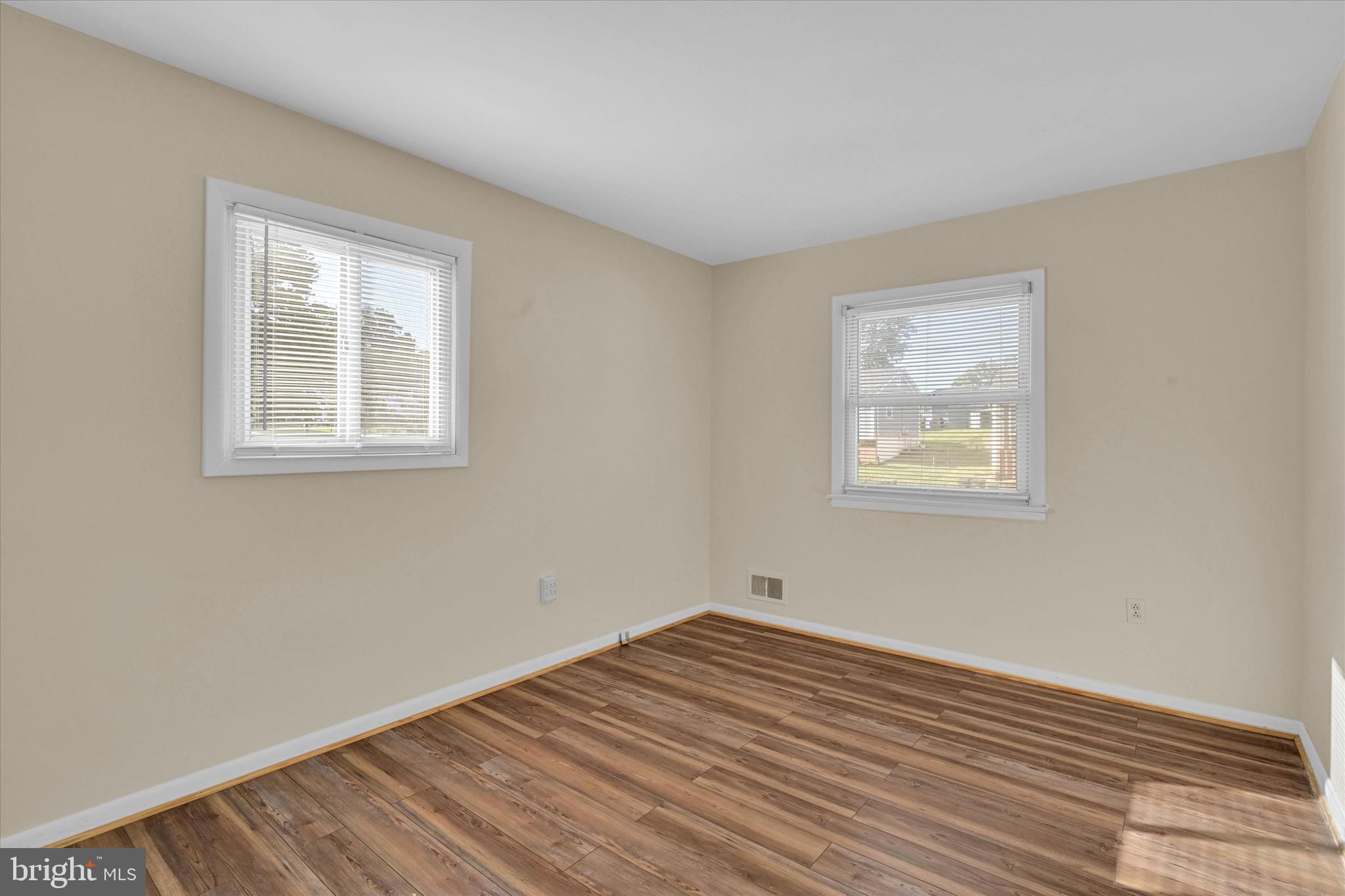 6812 Pepper Street Capitol Heights, MD 20743 - Photo 22 of 42 a view of empty room with wooden floor and fan