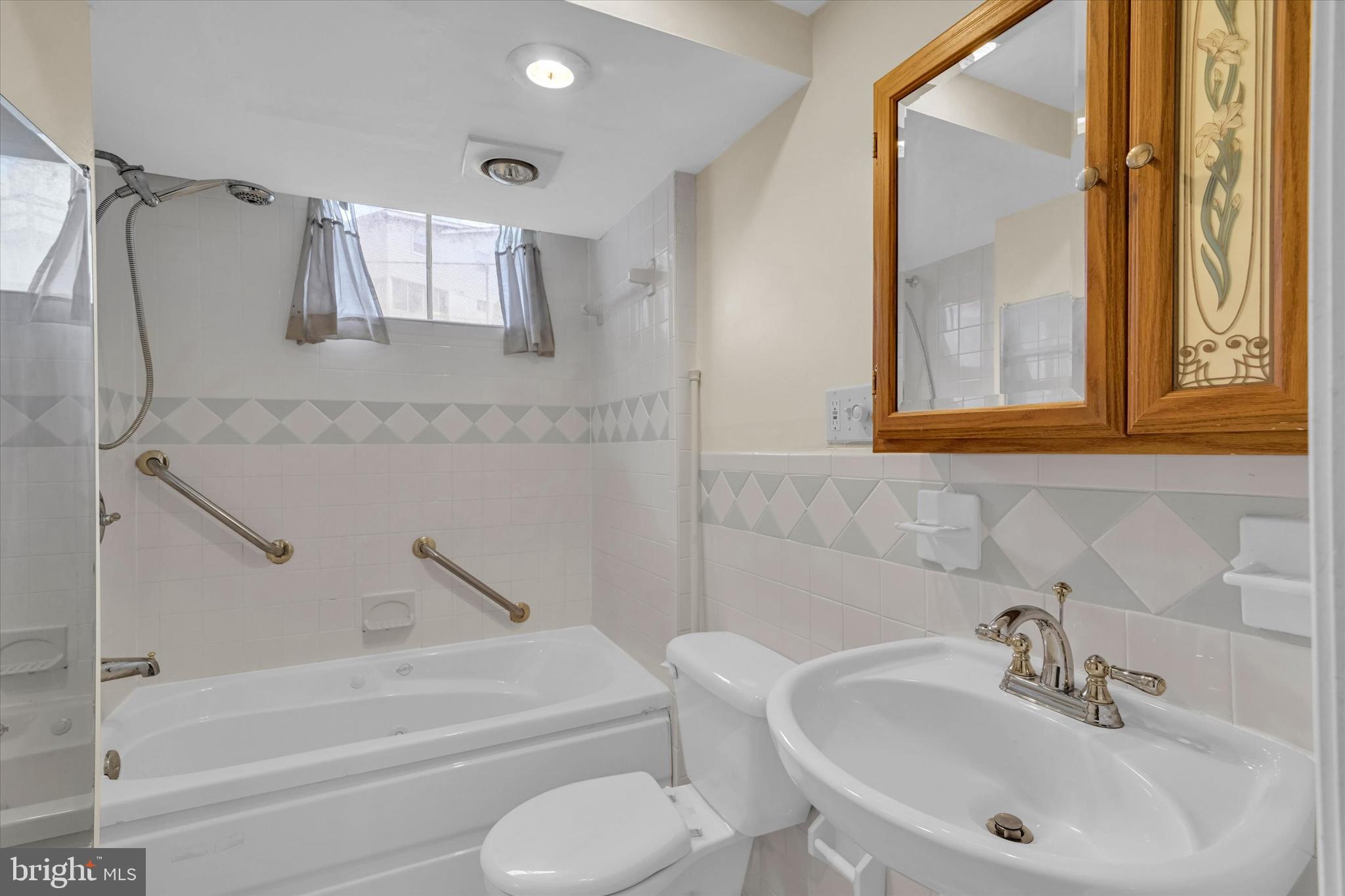 6812 Pepper Street Capitol Heights, MD 20743 - Photo 29 of 42 a bathroom with a sink toilet and shower