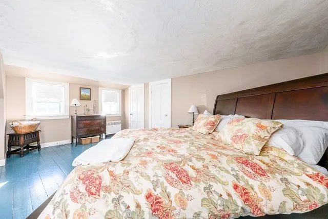 a bedroom with furniture and a window