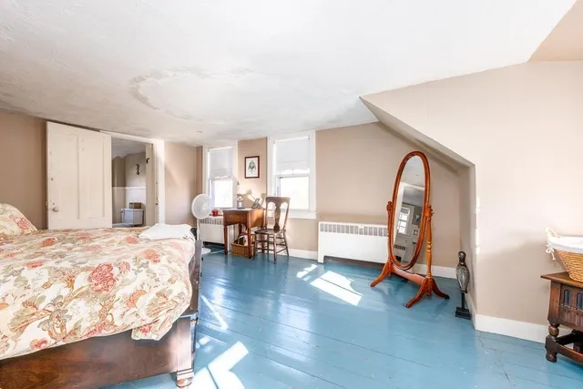 a living room with furniture a rug and a window
