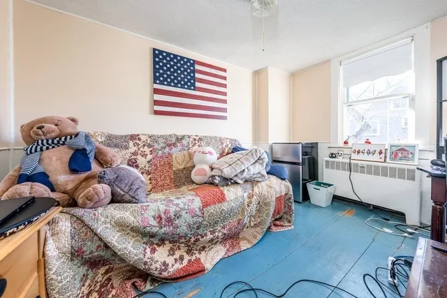 a view of a house with a yard and sitting area