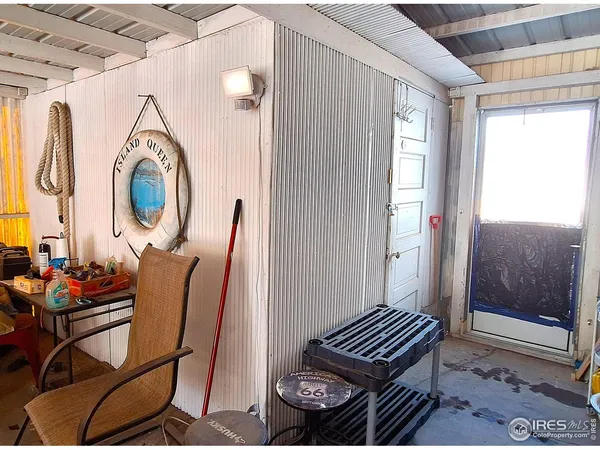 a view of a room with furniture and wooden floor