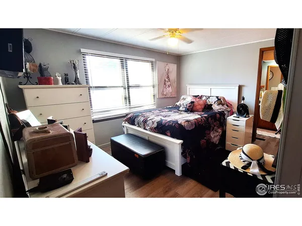 a living room with furniture a window and a flat screen tv