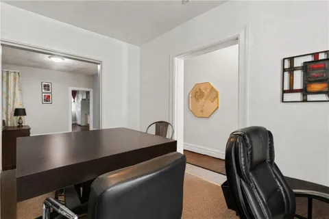 a view of a hallway with seating area