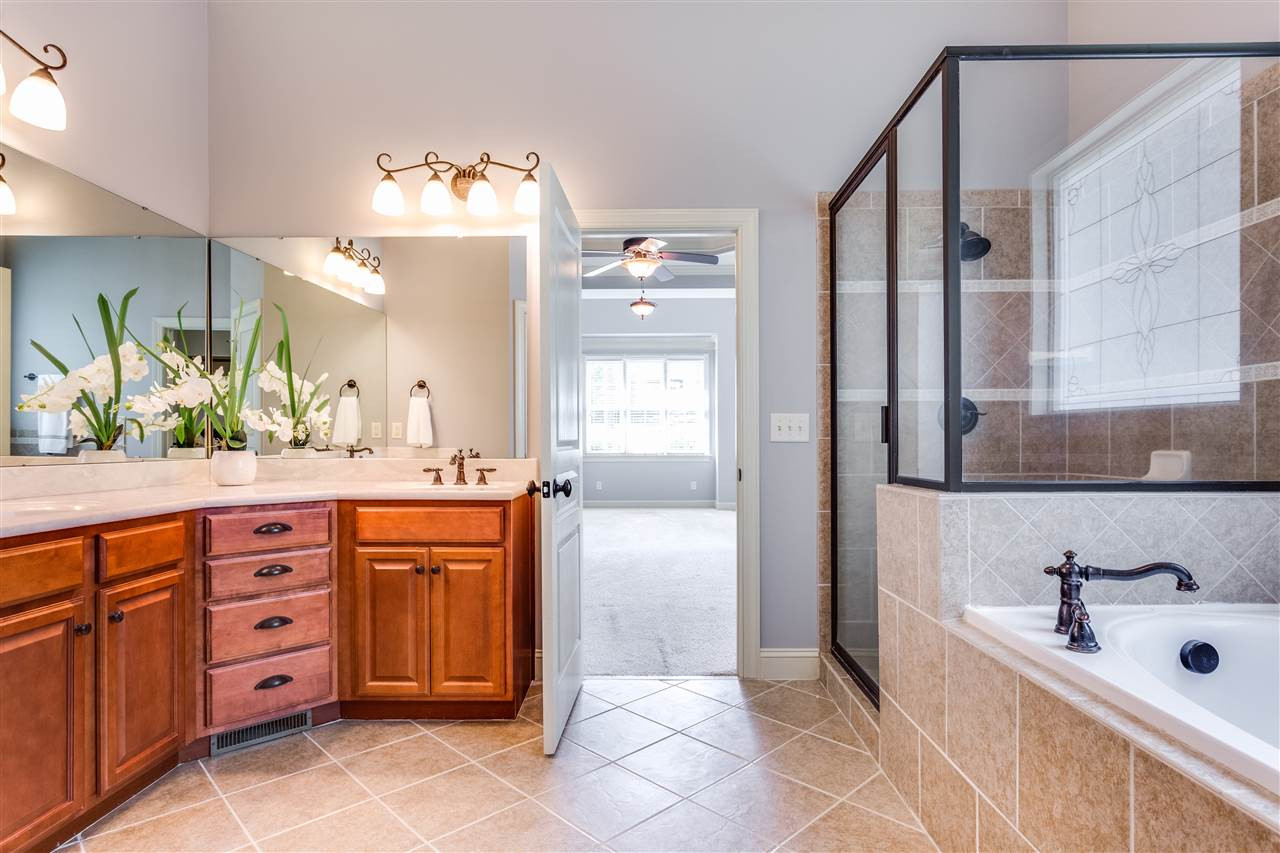 3509 Griffice Mill Road Raleigh, NC 27610 - Photo 12 of 20 Separate master shower and soaking tub along with custom tile and great size master closet. Master Bath/Spa