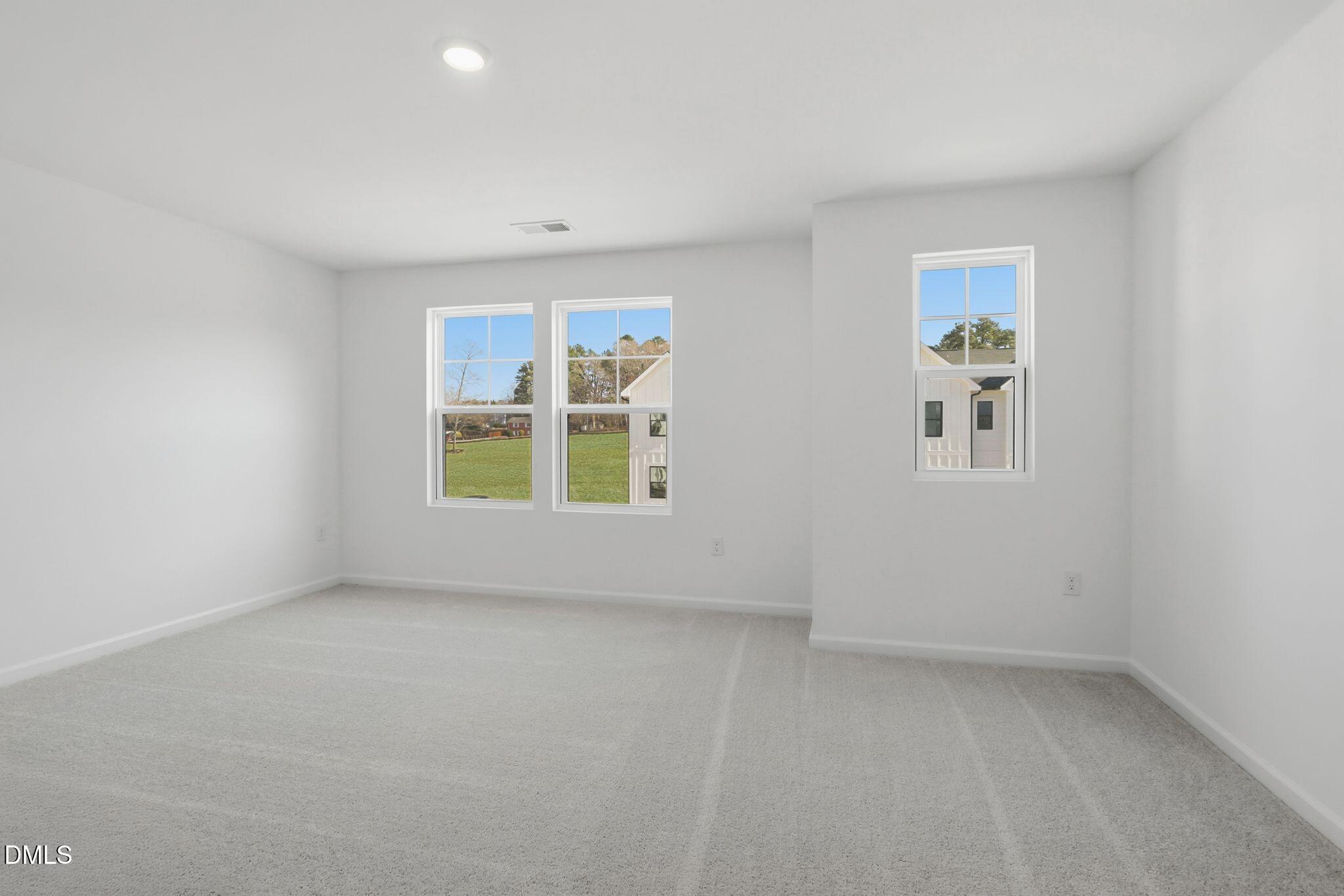 2309 Oakwood Mdws Court Raleigh, NC 27604 - Photo 25 of 34 an empty room with windows