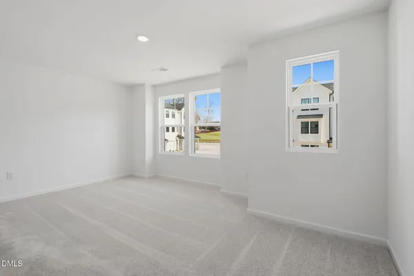 a view of an empty room with windows