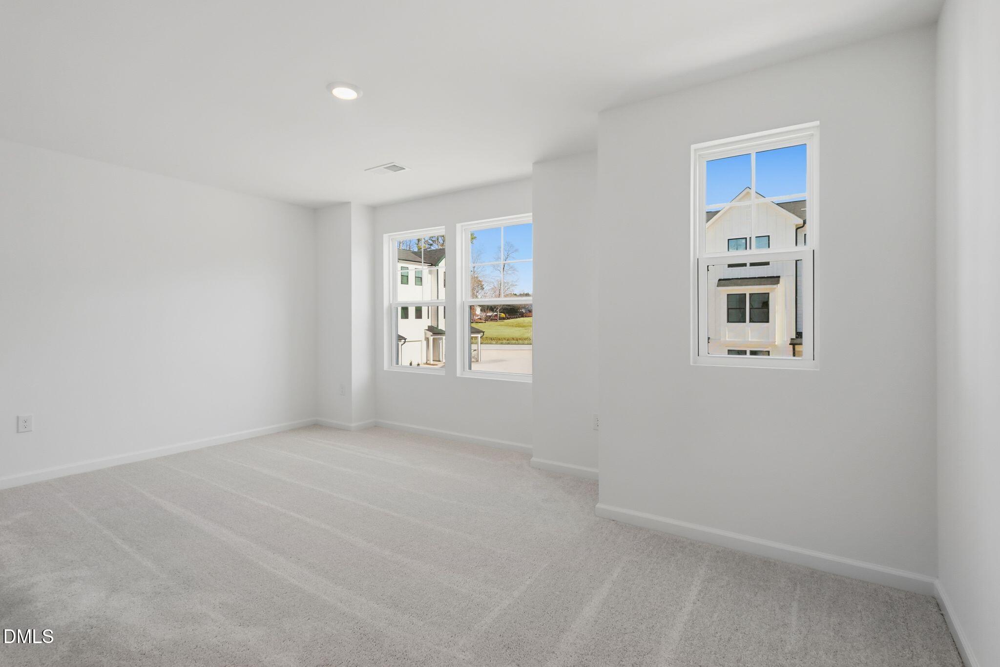 2309 Oakwood Mdws Court Raleigh, NC 27604 - Photo 26 of 34 a view of an empty room with windows