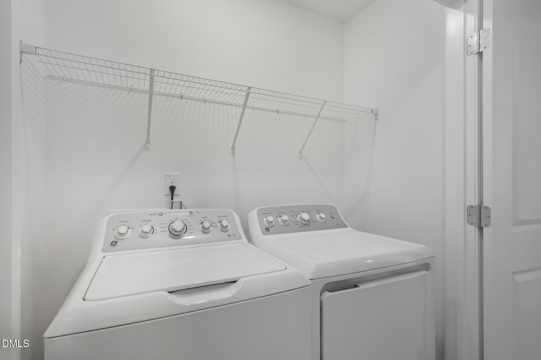 2309 Oakwood Mdws Court Raleigh, NC 27604 - Photo 28 of 34 a utility room with dryer and washer