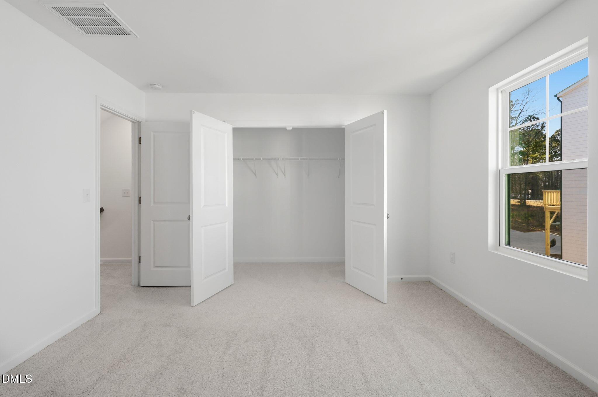 2309 Oakwood Mdws Court Raleigh, NC 27604 - Photo 31 of 34 an empty room with windows