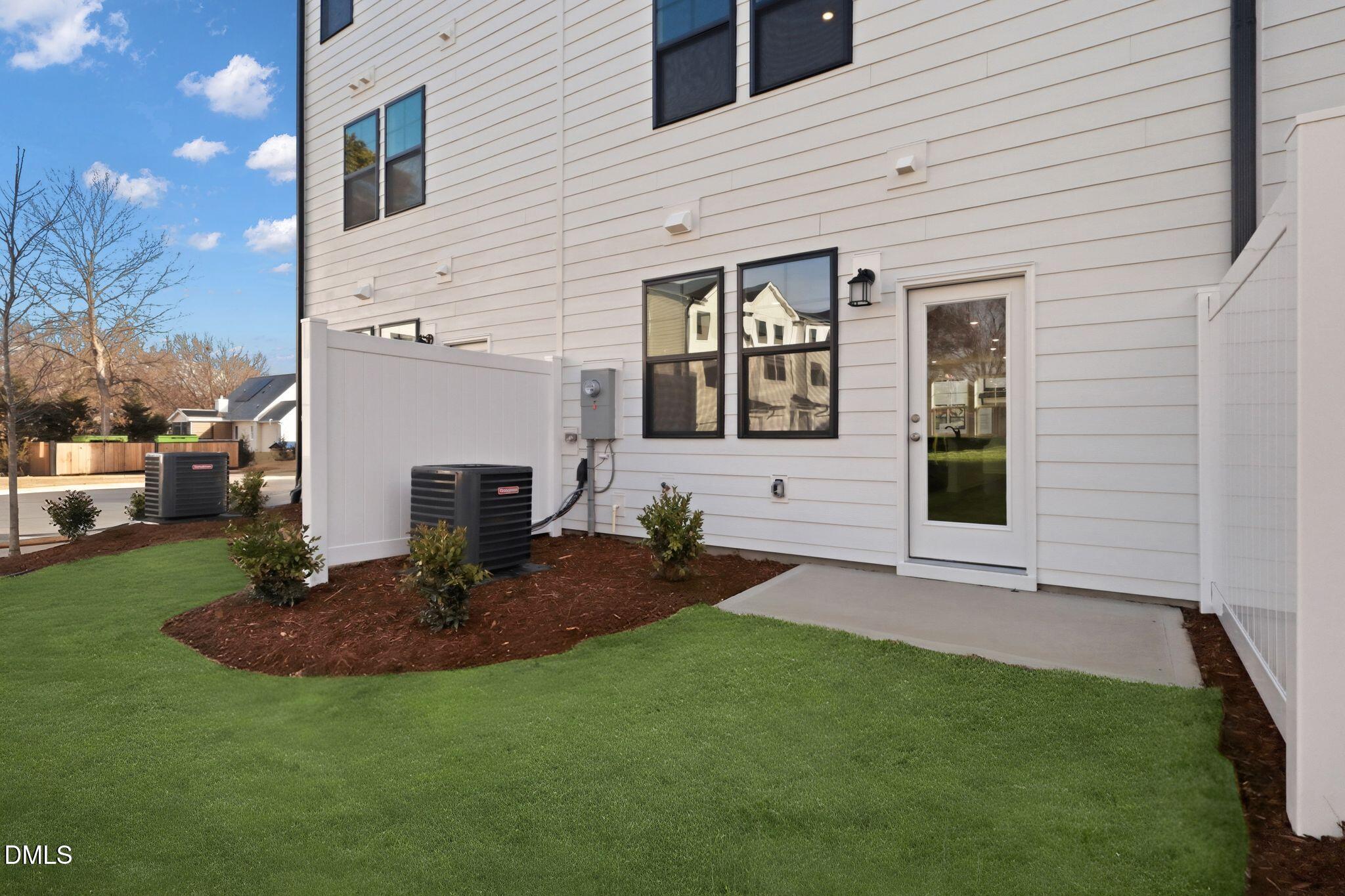 2309 Oakwood Mdws Court Raleigh, NC 27604 - Photo 33 of 34 a view of a backyard with table and chairs