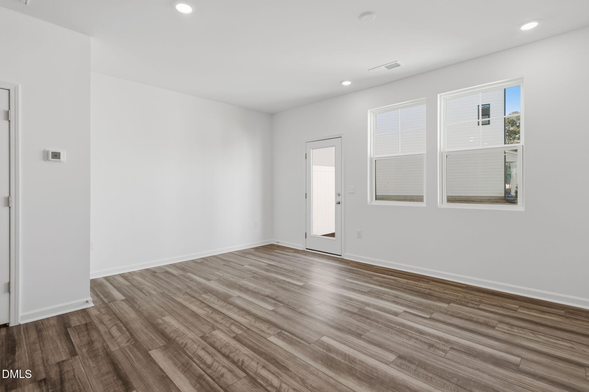 2309 Oakwood Mdws Court Raleigh, NC 27604 - Photo 7 of 34 a view of empty room with wooden floor