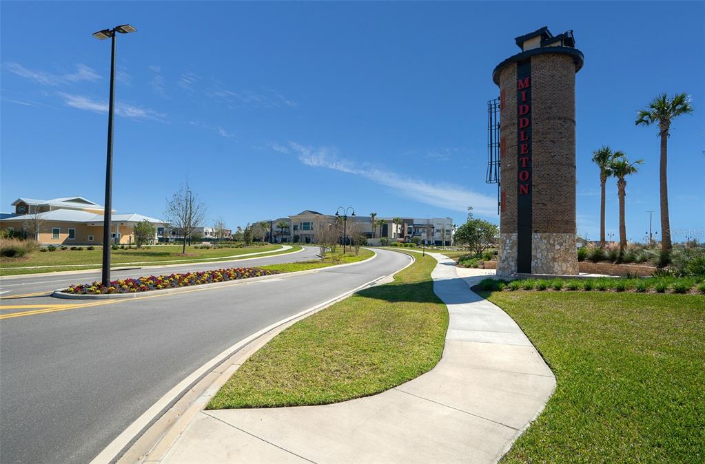 178 Highway 301 Sumterville, FL 33585 - Photo 24 of 25 a view of a swimming pool with a lawn chairs and a yard