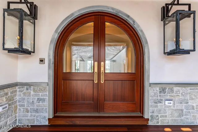 a view of a hallway with a flat screen tv