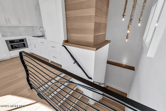 a view of a house with wooden fence