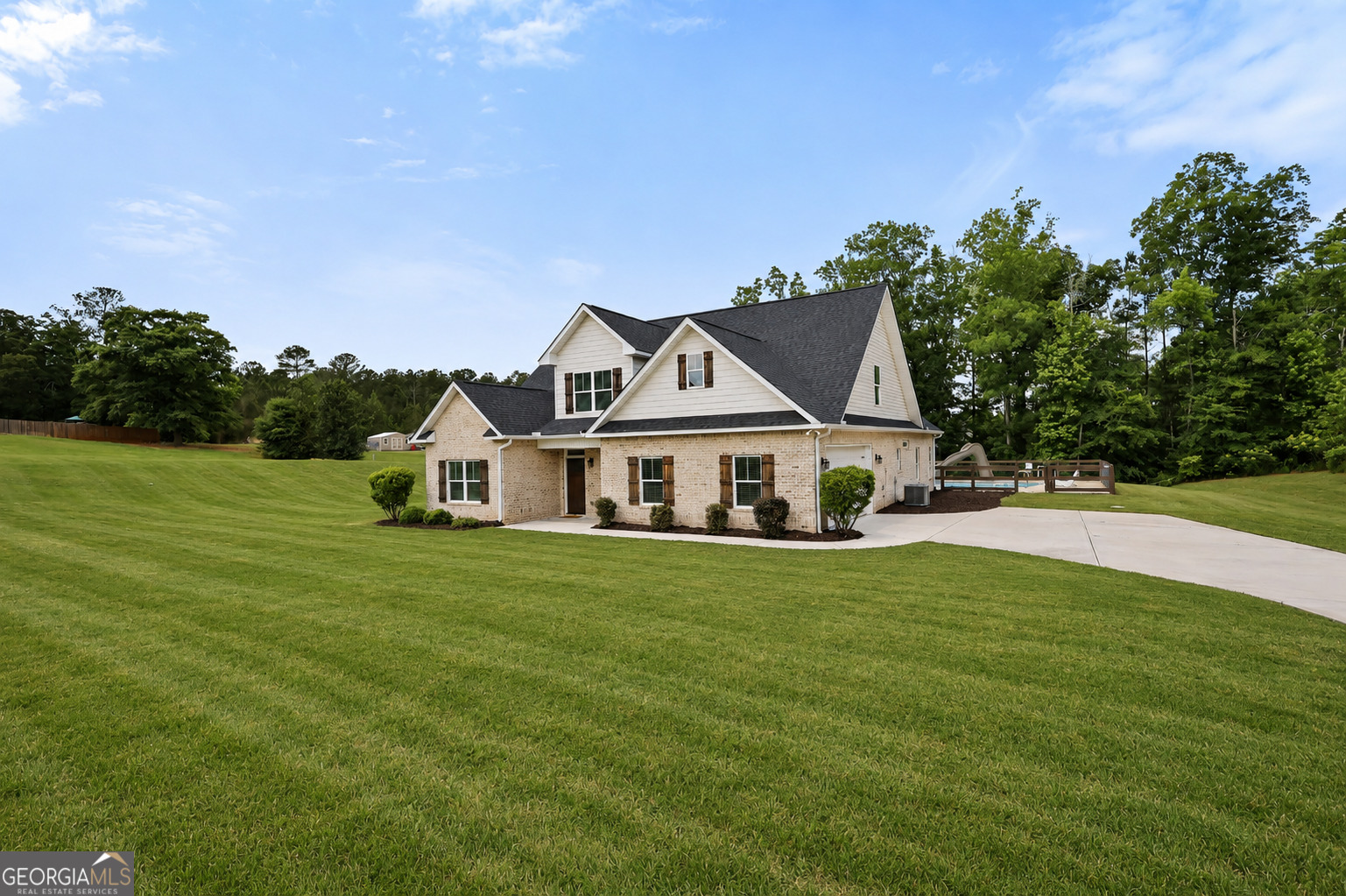 89 Claire Road Forsyth, GA 31029 - Photo 1 of 40 a front view of a house with a garden
