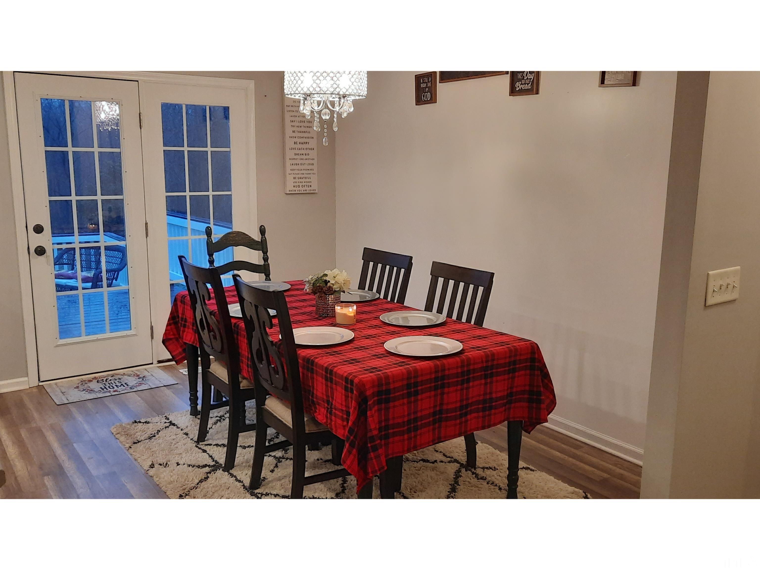 134 Collin Drive Roxboro, NC 27574 - Photo 14 of 31 a dining room with furniture and wooden floor