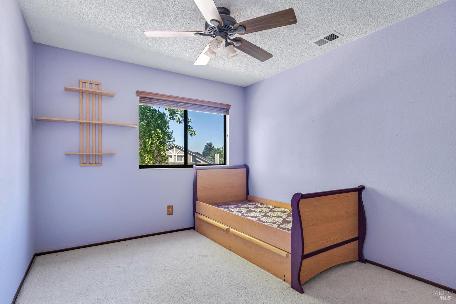 7408 Maximillian Place Rohnert Park, CA 94928 - Photo 11 of 19 West-facing bedroom offering warm afternoon sunlight and comfortable layout. Original finishes provide an excellent opportunity to personalize and create your ideal retreat.