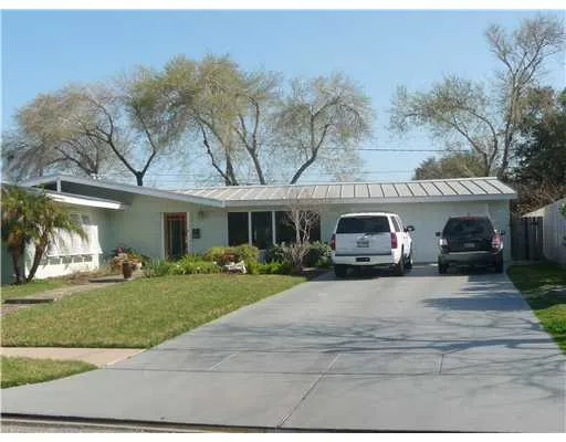 a view of a car parked in front of a house