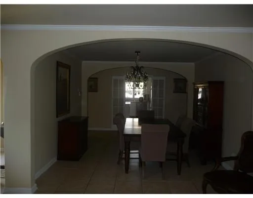 a view of a livingroom with furniture and chandelier