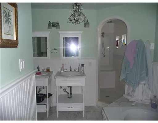 a bathroom with a sink and mirror