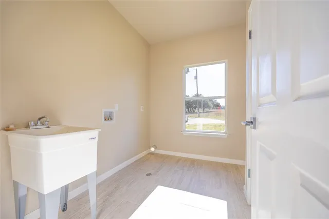 a room with a window and a sink