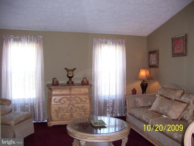 9417 Gunview Road Nottingham, MD 21236 - Photo 2 of 30 a living room with furniture and a fireplace