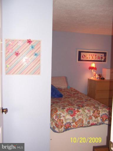 9417 Gunview Road Nottingham, MD 21236 - Photo 19 of 30 a bedroom with a bed and a dresser