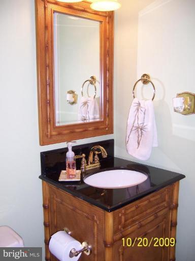 9417 Gunview Road Nottingham, MD 21236 - Photo 27 of 30 a bathroom with a sink and mirror