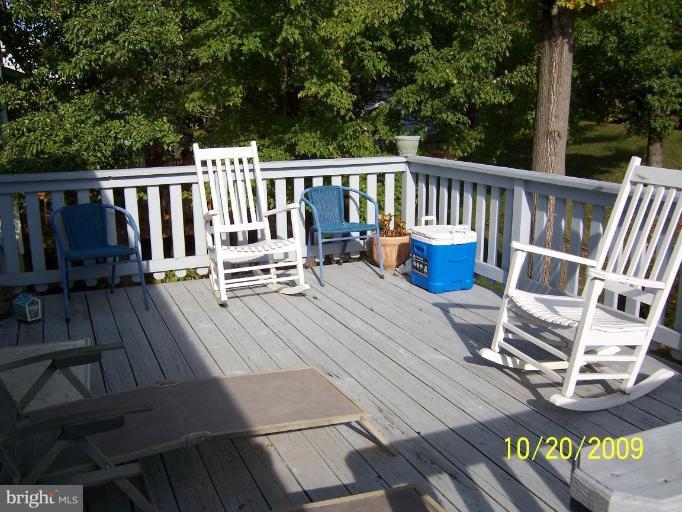 9417 Gunview Road Nottingham, MD 21236 - Photo 30 of 30 a view of balcony with wooden floor and outdoor seating