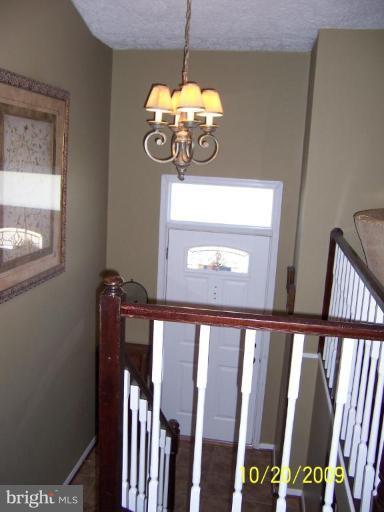 9417 Gunview Road Nottingham, MD 21236 - Photo 7 of 30 a view of a hallway with windows