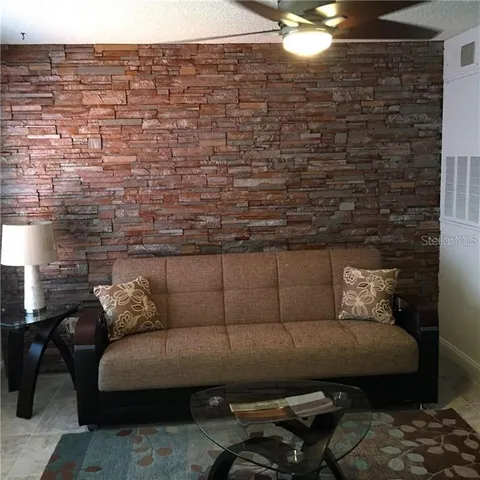 a bedroom with a bed and lamp