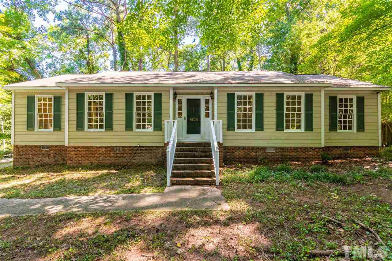 8700 Brandon Station Road Raleigh, NC 27613 - Photo 1 of 23 a front view of a house with a yard