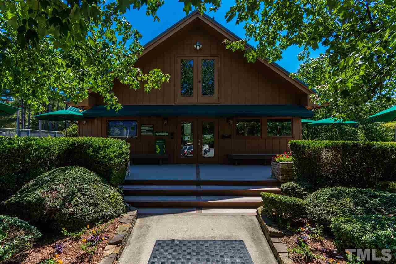8700 Brandon Station Road Raleigh, NC 27613 - Photo 22 of 23 a front view of a house with a yard
