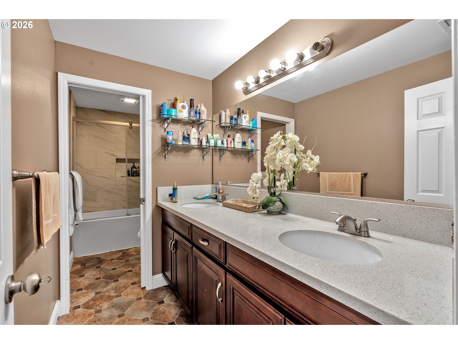 21498 Southwest Jay Street Beaverton, OR 97003 - Photo 30 of 47 a bathroom with a granite countertop sink a mirror and a shower