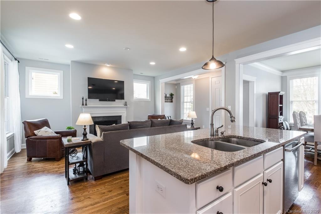 3482 Richard's Crossing Fort Mill, SC 29708 - Photo 5 of 24 a kitchen with granite countertop a sink a counter space appliances and cabinets