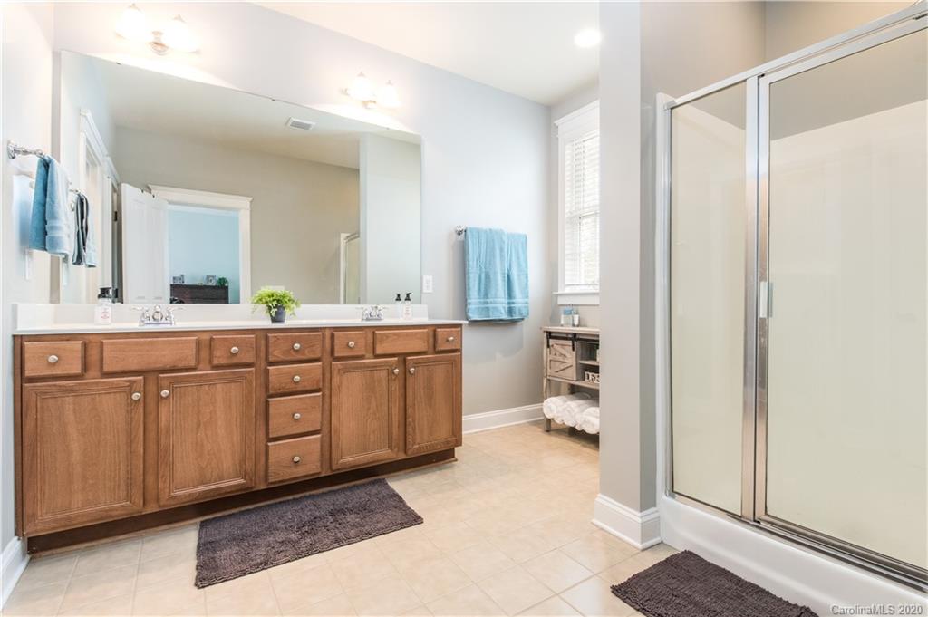 3482 Richard's Crossing Fort Mill, SC 29708 - Photo 8 of 24 a spacious bathroom with a double vanity sink a mirror and a shower