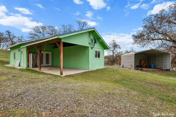 a kitchen with stainless steel appliances granite countertop a stove a refrigerator and a sink
