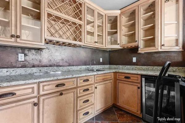 a kitchen with stainless steel appliances granite countertop a sink and cabinets