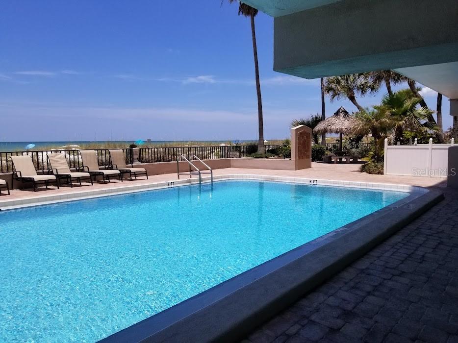 13650 Gulf Boulevard, Unit 304 Madeira Beach, FL 33708 - Photo 63 of 63 a view of swimming pool with outdoor seating