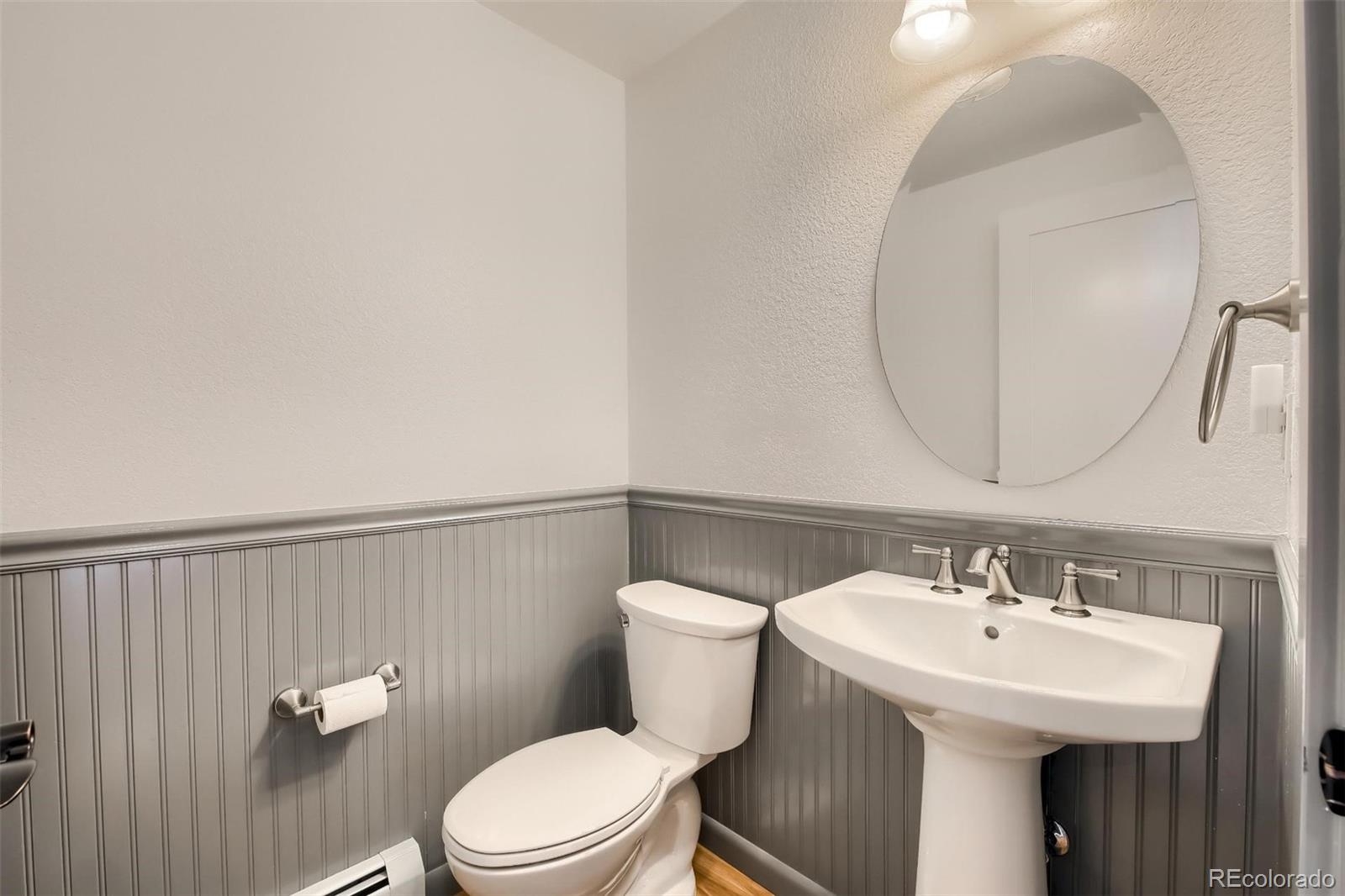 1320 Chambers Drive Boulder, CO 80305 - Photo 11 of 39 a bathroom with a sink a toilet and a mirror