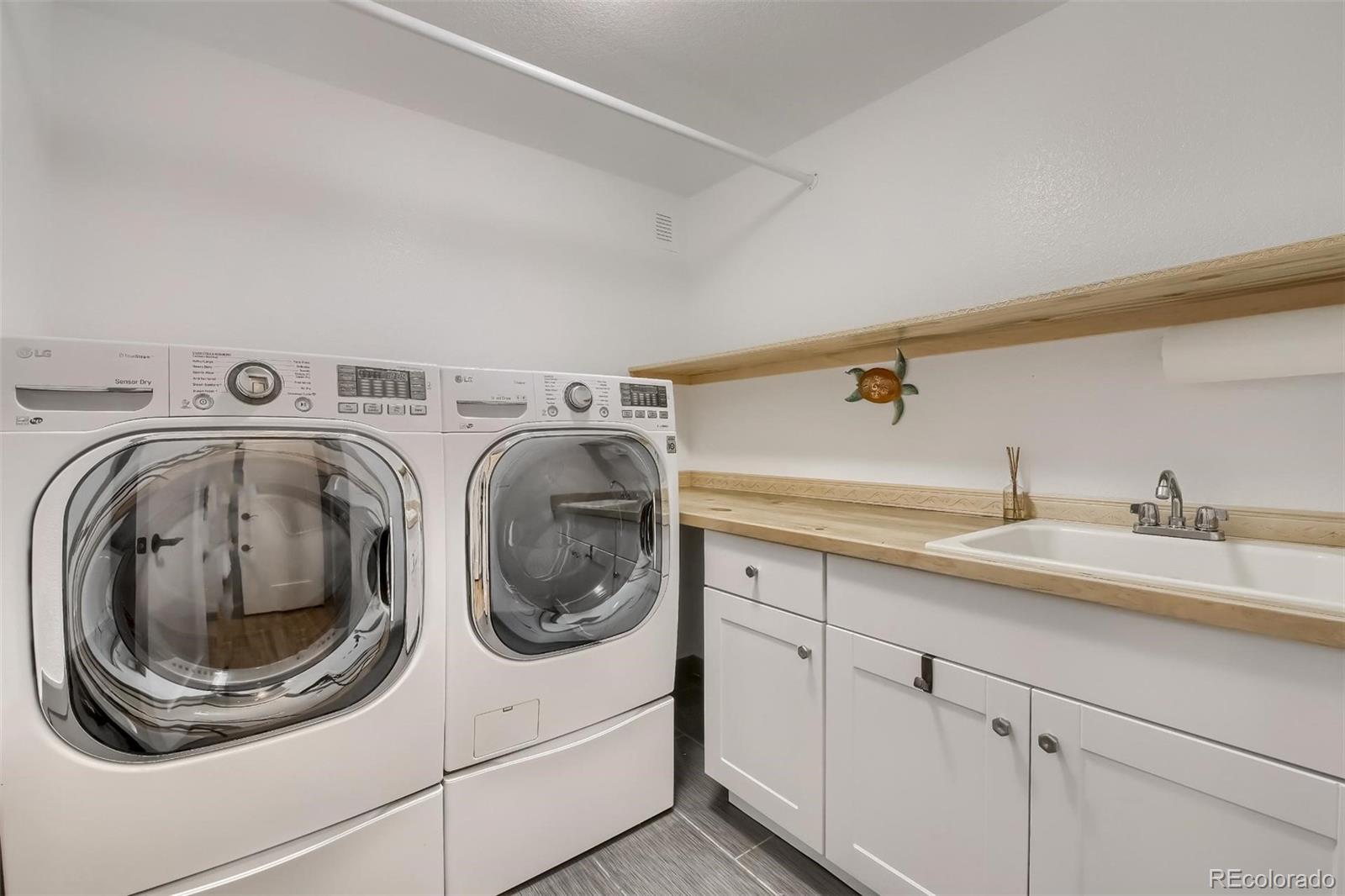 1320 Chambers Drive Boulder, CO 80305 - Photo 16 of 39 a utility room with sink dryer and washer